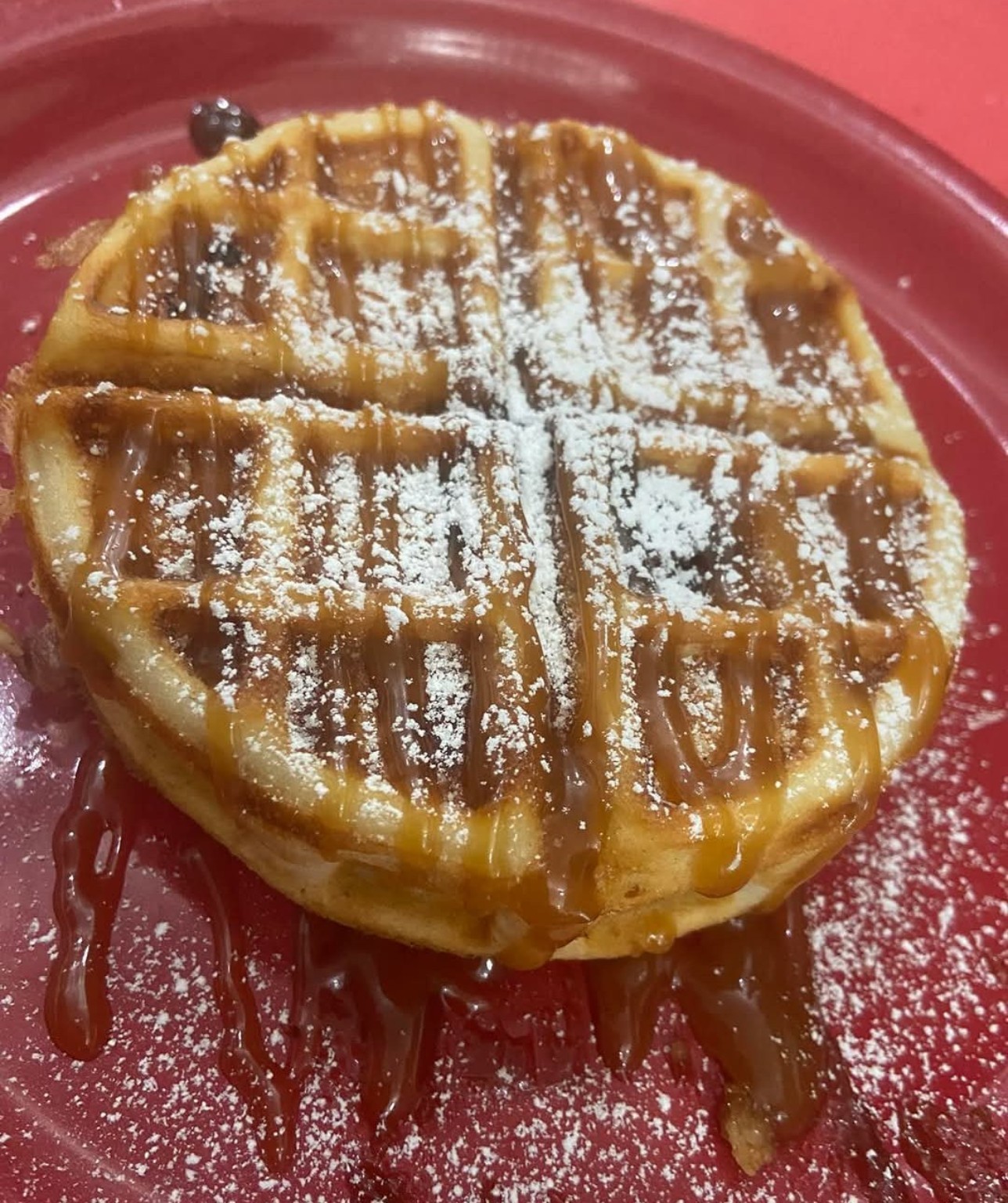 Golden waffle with powdered sugar